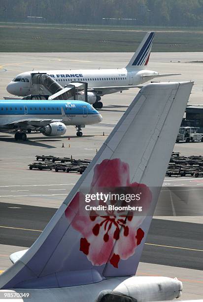 Aircraft from Air France, rear, KLM, center and China Airlines sit on the tarmac at Frankfurt International Airport , in Frankfurt, Germany, on...