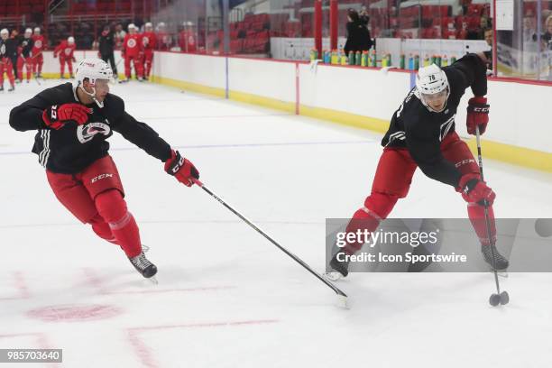 Carolina Hurricanes Prospect Camp Defenseman Theo Calvas with the puck while Carolina Hurricanes Prospect Camp Defenseman Jesper Sellgren goes for it...