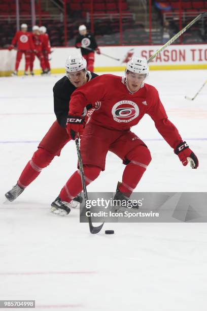 Carolina Hurricanes Prospect Camp Center Matt Filipe with the puck while Carolina Hurricanes Prospect Camp Defenseman Brendan De Jong behind him...