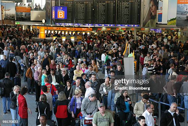 Stranded passengers wait for travel information at Frankfurt International Airport , in Frankfurt, Germany, on Tuesday, April 20, 2010. European...