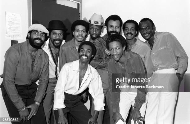 American jazz and R&B group, Kool & the Gang, posing backstage, London, England, 1982. From left, Rick Westfield , Dennis "DT" Thomas , Robert 'Kool'...