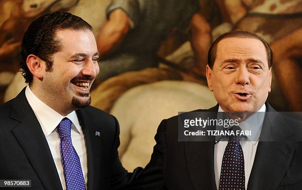Italian Prime Minister Silvio Berlusconi and Lebanese counterpart Saad Hariri smile after their meeting on April 20, 2010 at Palazzo Chigi in Rome....