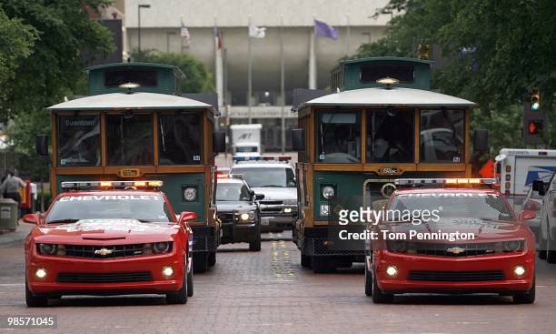 Texas Governor Rick Perry, Fort Worth Mayor Mike Moncrief, and NASCAR drivers Colin Braun and Bobby Labonte arrive in downtown Fort Worth on Molly...