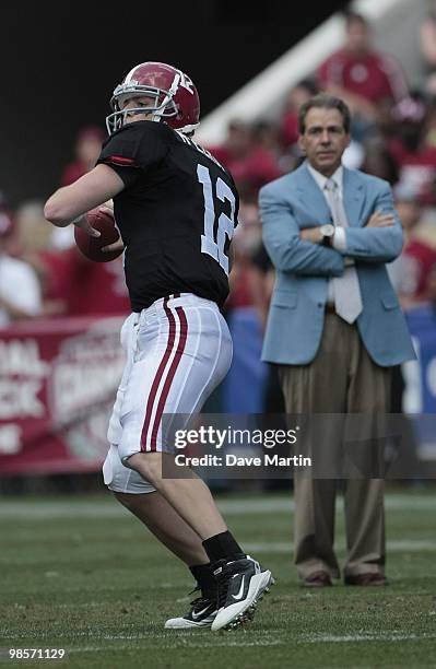 Coach Nick Saban of the Alabama Crimson Tide watches quarterback Greg McElroy throw during the Alabama spring game at Bryant Denny Stadium on April...