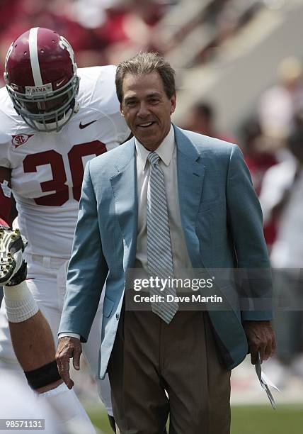 Coach Nick Saban of the Alabama Crimson Tide talks with his players before the Alabama spring game at Bryant Denny Stadium on April 17, 2010 in...