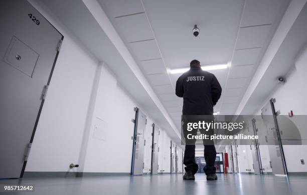 Prison guard standing in the recently renovated B-wing of the Holstenglacis remand centre during a tour for the press in Hamburg, Germany, 08...