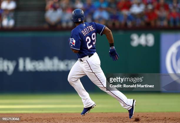 Adrian Beltre of the Texas Rangers hits a rbi double in the third inning against the San Diego Padres at Globe Life Park in Arlington on June 27,...