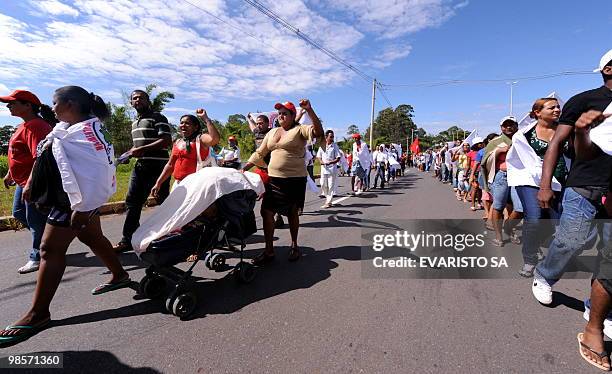 Indigenous from several tribes and social movement activists march towards the headquarters of the National Electric Energy Agency in Brasilia, to...