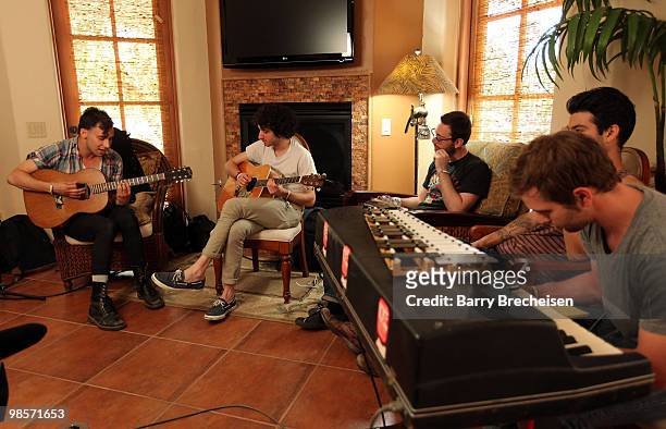 Musicians Jay West, Jack Antonoff, Jon Shiffman, Evan Winiker and Justin Huey of Steel Train perform for The Voice Project at the LACOSTE Pool Party...