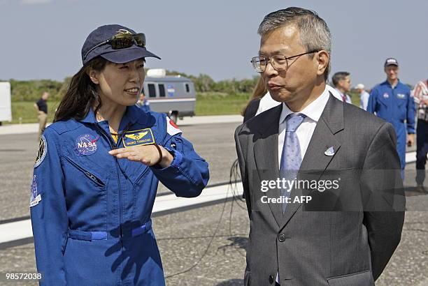 Mission specialist Naoko Yamazaki of the Japan Aerospace Exploration Agency talks with Dr. Kuniaki Shiraki , executive director of JAXA, after the...