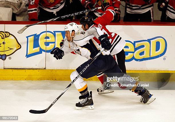 Shea Weber of the Nashville Predators and John Madden of the Chicago Blackhawks race up the ice in Game Two of the Western Conference Quarterfinals...