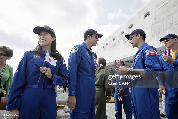 Mission specialist Naoko Yamazaki of the Japan Aerospace Exploration Agency with crew members Rick Mastracchio , pilot Jim Dutton and commander Alan...