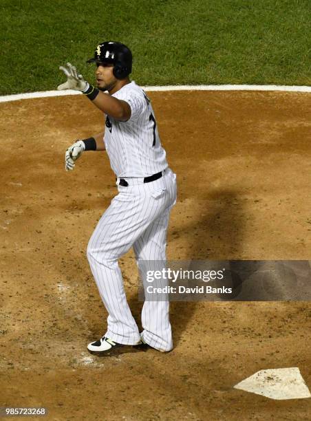 Jose Abreu of the Chicago White Sox reacts after crossing home plate after hitting a home run against the Minnesota Twins during the fifth inning on...