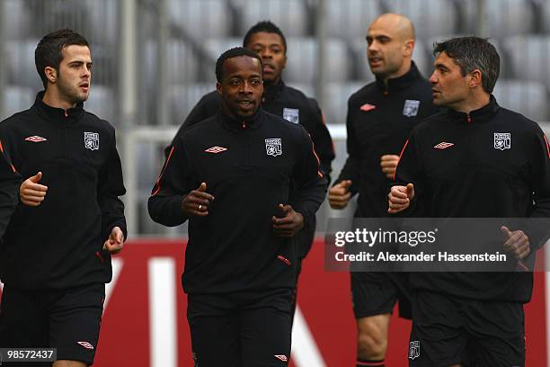 Sidney Govou of Olympic Lyon runs with his team mates during a training session at Allianz Arena on April 20, 2010 in Munich, Germany. Olympic Lyon...