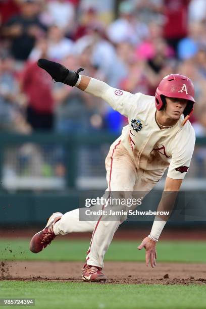 Casey Martin of Arkansas catches his footing while running during the Division I Men's Baseball Championship held at TD Ameritrade Park on June 26,...