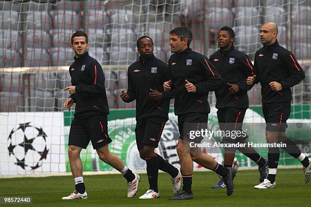 Sidney Govou of Olympic Lyon runs with his team mates during a training session at Allianz Arena on April 20, 2010 in Munich, Germany. Olympic Lyon...