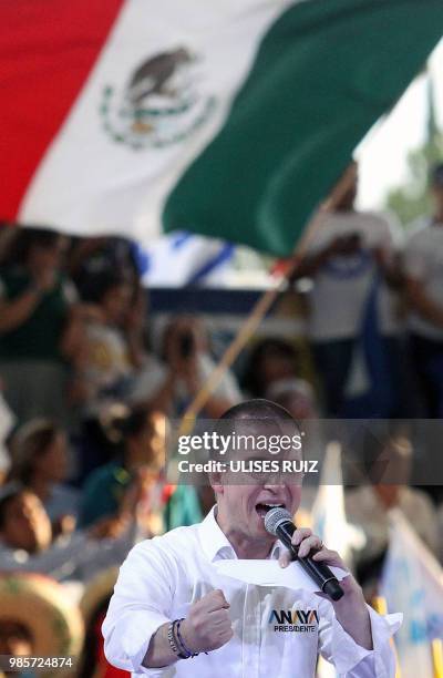 Mexico's presidential candidate Ricardo Anaya, standing for the "Mexico al Frente" coalition of the PAN-PRD-Movimiento Ciudadano parties, speaks to...