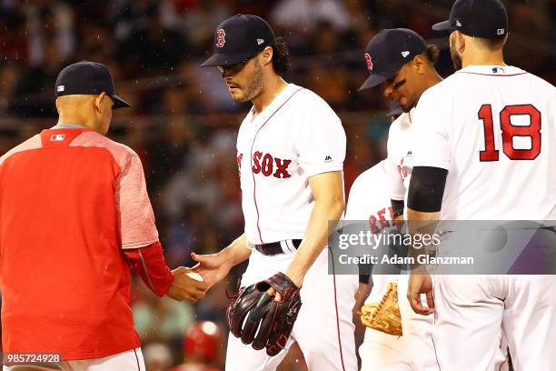 Joe Kelly of the Boston Red Sox is taken out of the game in the seventh inning by Manager Alex Cora during a game against the Los Angeles Angels at...