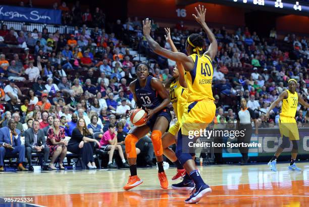 Connecticut Sun forward Chiney Ogwumike doubled-teamed by Indiana Fever forward Erica McCall and Indiana Fever center Kayla Alexander during a WNBA...