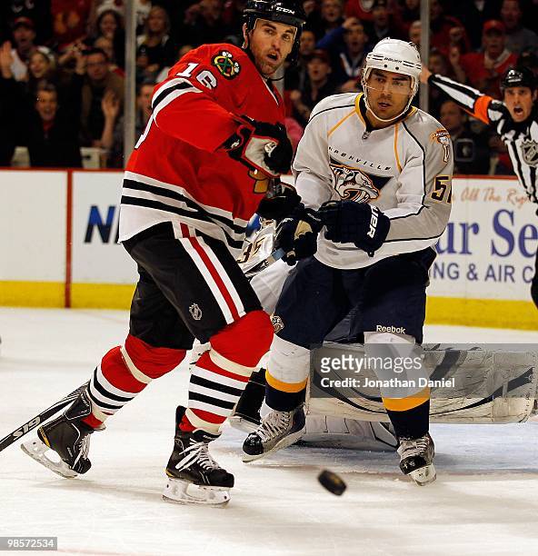 Francis Bouillon of the Nashville Predators and Andrew Ladd of the Chicago Blackhawks watch the puck in Game Two of the Western Conference...
