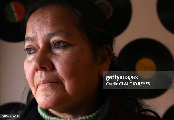 Chilean Josefina Sandoval poses during an interview with AFP in Santiago, on June 10, 2018. - Josefina Sandoval gave birth to a girl on June 24, 1980...