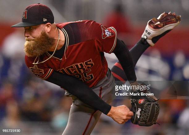 Archie Bradley of the Arizona Diamondbacks pitches in the eighth inning during the game against the Miami Marlins at Marlins Park on June 27, 2018 in...
