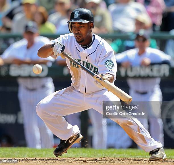 Chone Figgins of the Seattle Mariners bunts against the Detroit Tigers at Safeco Field on April 18, 2010 in Seattle, Washington. The Tigers defeated...