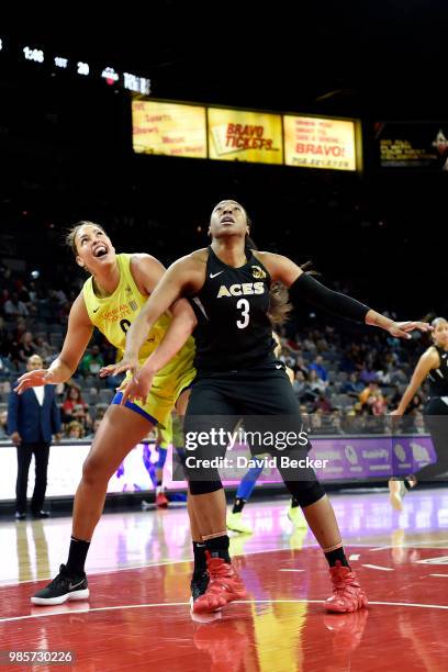 Elizabeth Cambage of the Dallas Wings and Kelsey Bone of the Las Vegas Aces box out during the game between the two teams on June 27, 2018 at the...