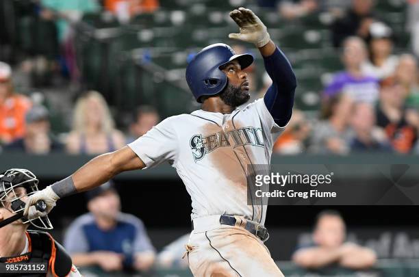Denard Span of the Seattle Mariners drives in the winning run with a sacrifice fly in the eleventh inning against the Baltimore Orioles at Oriole...