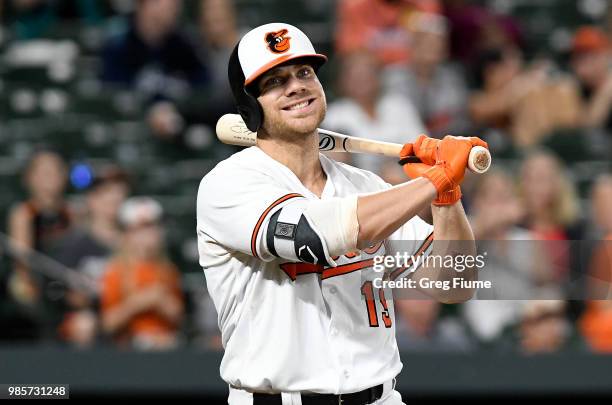 Chris Davis of the Baltimore Orioles reacts after striking out in the eleventh inning against the Seattle Mariners at Oriole Park at Camden Yards on...