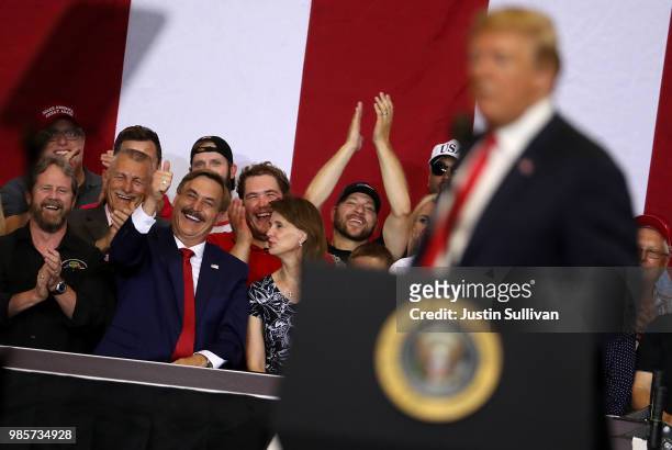 Suppoters cheer as U.S. President Donald Trump speaks during a campaign rally at Scheels Arena on June 27, 2018 in Fargo, North Dakota. President...