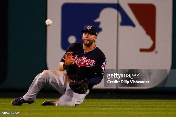 Lonnie Chisenhall of the Cleveland Indians catches a fly ball against the St. Louis Cardinals in the seventh inning at Busch Stadium on June 27, 2018...