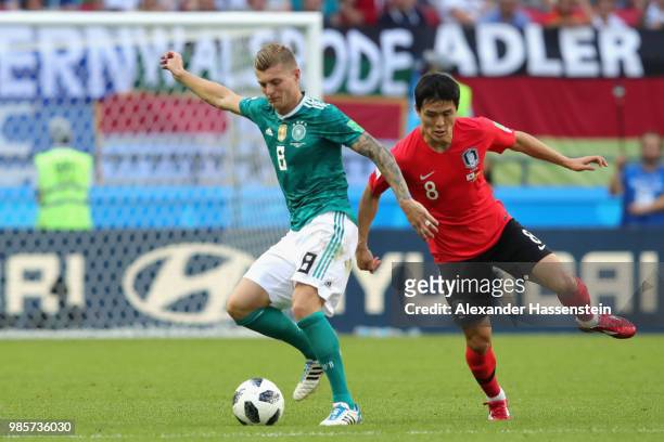 Toni Kroos of Germany tackles Sejong Ju of Korea Republic during the 2018 FIFA World Cup Russia group F match between Korea Republic and Germany at...