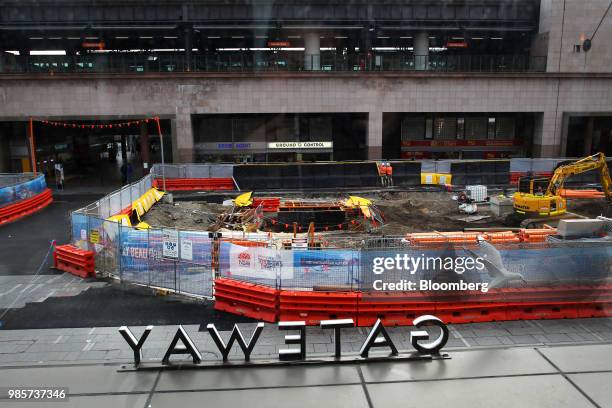 Materials and equipment stand at a construction site near the Circular Quay railway station in the central business district of Sydney, Australia, on...