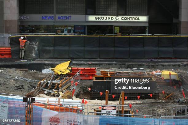 Materials and equipment stand at a construction site near the Circular Quay railway station in the central business district of Sydney, Australia, on...