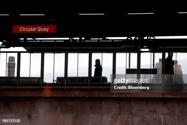 People walk along a platform at Circular Quay railway station in the central business district of Sydney, Australia, on Monday, June 18, 2018....