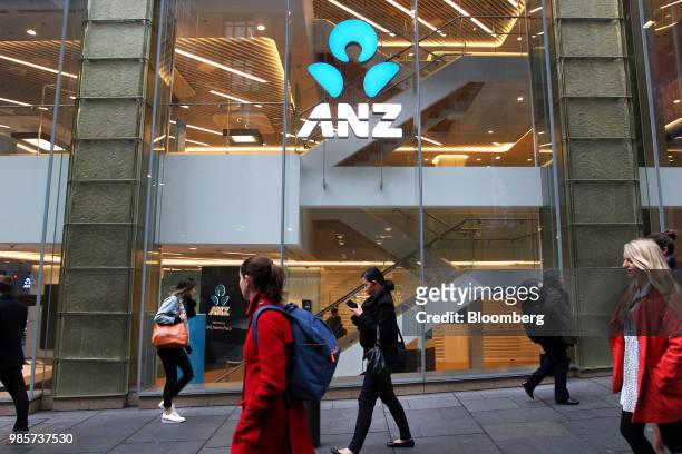 Pedestrians walk past an Australia & New Zealand Banking Group Ltd. Branch in the central business district of Sydney, Australia, on Monday, June 18,...