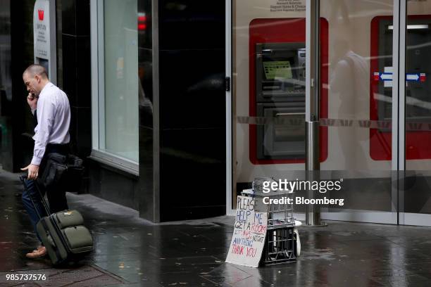 Begging bowl sits outside a Westpac Banking Corp. Branch in the central business district of Sydney, Australia, on Thursday, June 21, 2018. Australia...