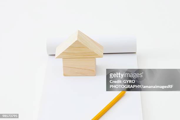 wooden block house and pencil on blank notepad - creative rf stock-grafiken, -clipart, -cartoons und -symbole