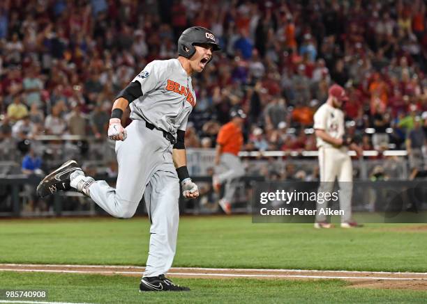 Outfielder Trevor Larnach of the Oregon State Beavers reacts after hitting a two run home run to give the Beavers a 5-3 lead in the ninth inning...