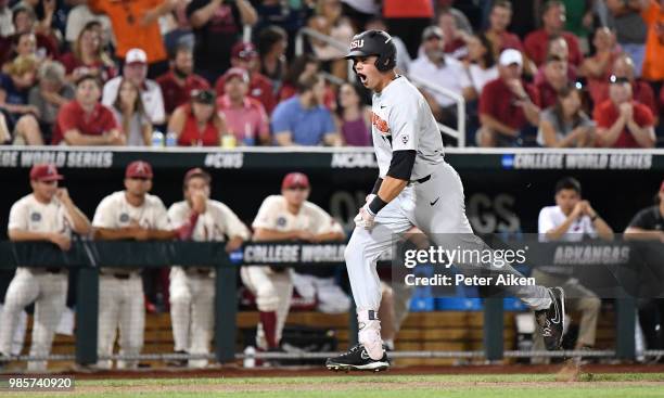 Outfielder Trevor Larnach of the Oregon State Beavers reacts after hitting a two run home run to give the Beavers a 5-3 lead in the ninth inning...