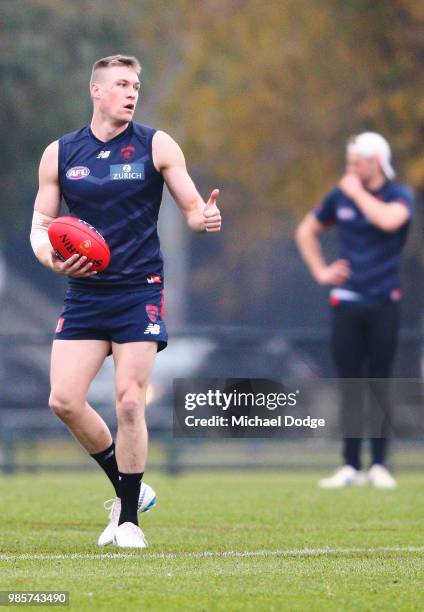 Tom McDonald of the Demons, injured from his last match with a bruised lung, gestures in his fitness test during a Melbourne Demons AFL training...