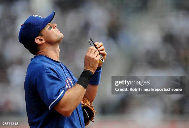 Michael Young of the Texas Rangers looks on against the New York Yankees at Yankee Stadium on April 18, 2010 in the Bronx borough of Manhattan. The...