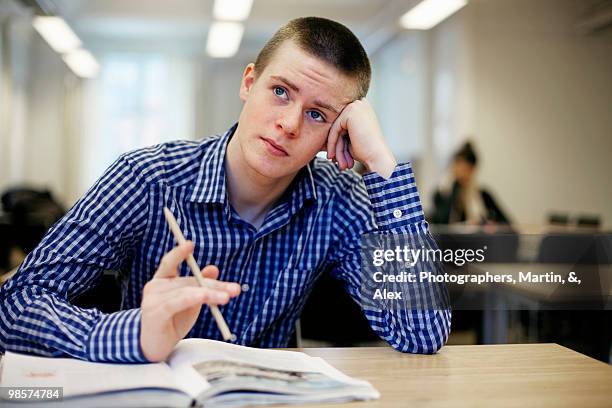 pensive boy at school, sweden. - alex boys stockfoto's en -beelden