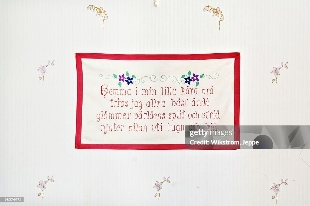 Embroidered message on a wall hanging, Sweden.