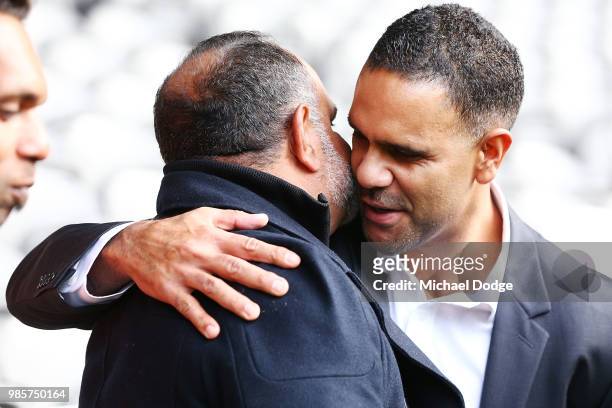 Michael Long, hugged by Michael O'Loughlin makes a suprise appearance from illness during an Indigenous Past Player Group announcement at Etihad...