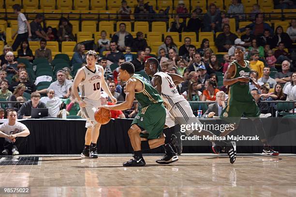 Desmon Farmer of the Reno Bighorns drives the ball against Andre Ingram of the Utah Flash at McKay Events Center on March 05, 2010 in Orem, Utah....