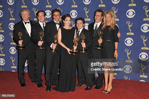 Writer/director/actress Tina Fey and the staff of '30 Rock' pose in the press room at the 61st Primetime Emmy Awards held at the Nokia Theatre on...