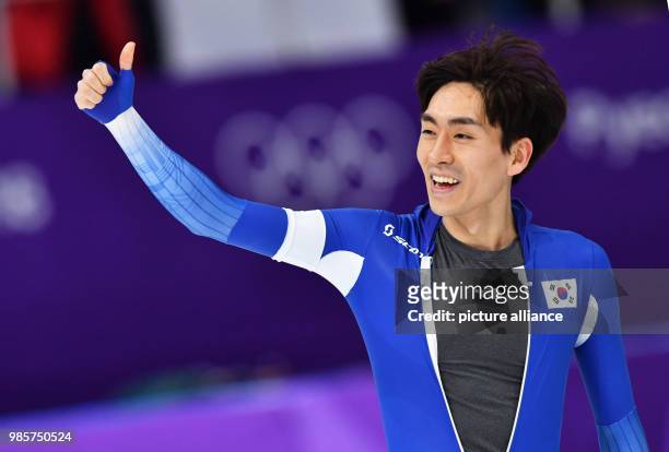 South Korea's Lee Seung-Hoon celebrates after the men's 5,000m speed skating event on day two of the Pyeongchang 2018 Winter Olympics Games at the...