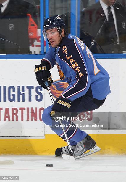 Evgeny Artyukhin of the Atlanta Thrashers carries the puck against the Buffalo Sabres at Philips Arena on March 16, 2010 in Atlanta, Georgia.